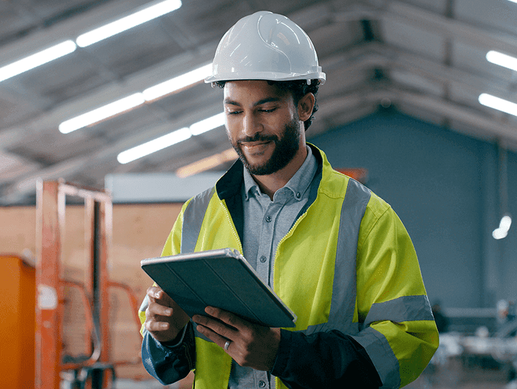 Warehouse worker checking a tablet